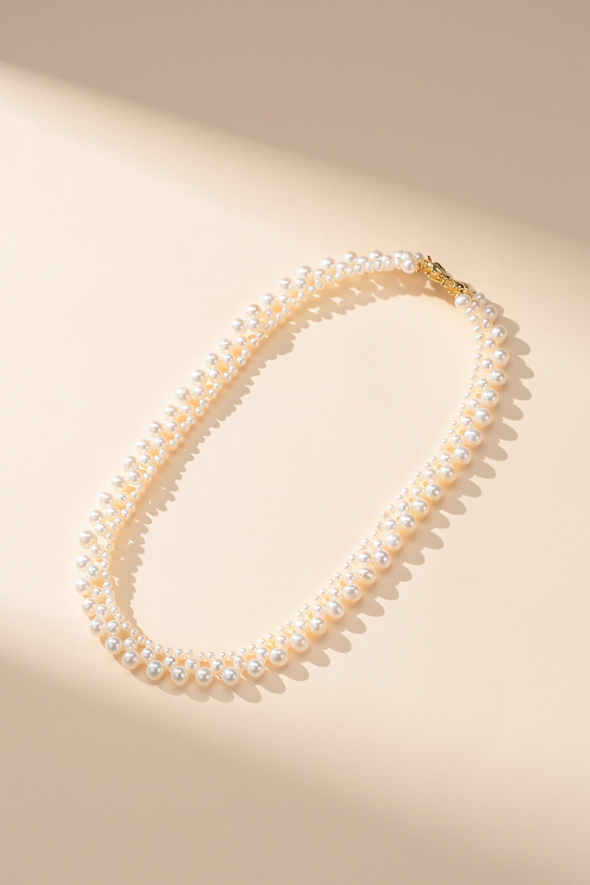 Gradual Pearl Braided Bow Necklace